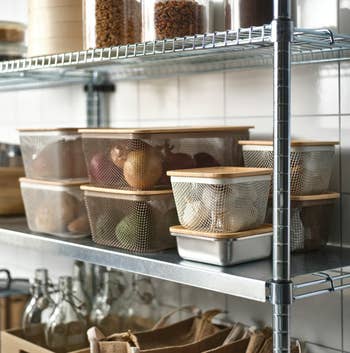 Mesh retention  bins filled with onions and potatoes connected  a room  support  alongside jars and bottles, perfect  for organized pantry retention  solutions