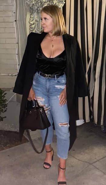 reviewer wearing the black bodysuit with jeans