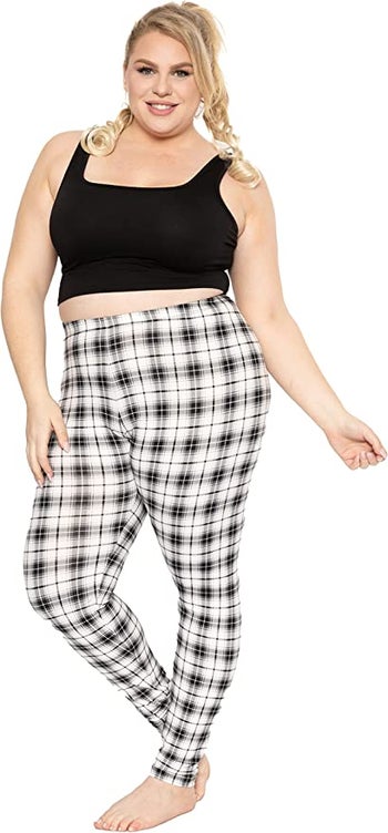 Model wearing plaid leggings