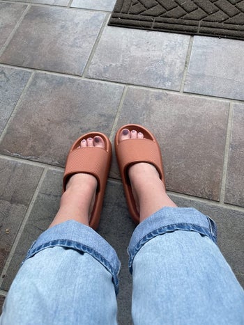 A reviewer in the terracotta sandals