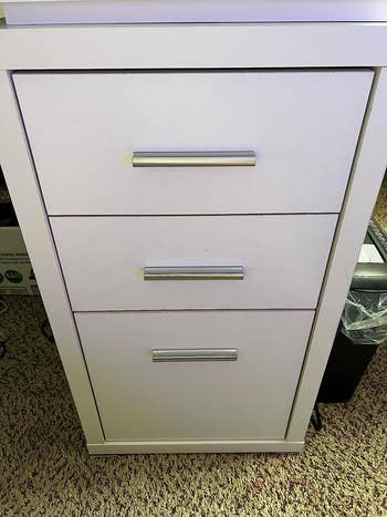 before of a cabinet with silver drawer pulls