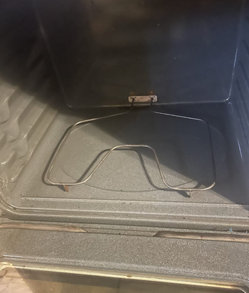 the same reviewer's oven looking clean after using the spray