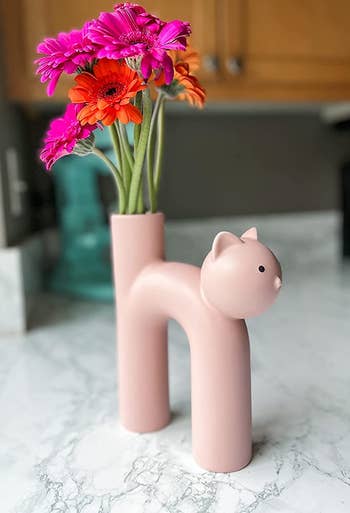 reviewer's pink vase with flowers in it