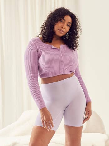 The model wearing the shorts in color lilac