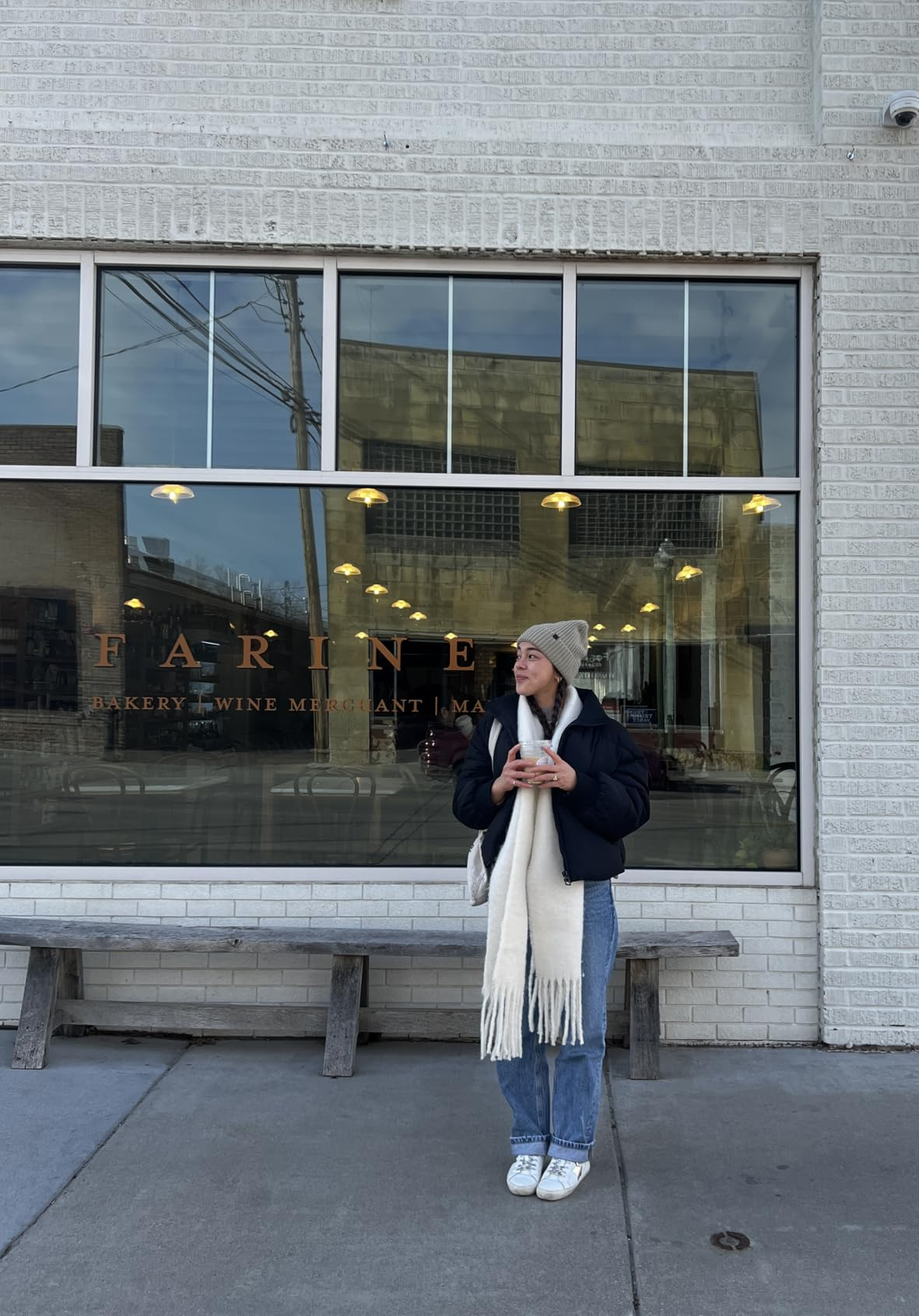 Person successful  lukewarm  covering  holding a portion  and lasting  successful  beforehand   of a bakery window