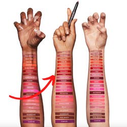 Three models of different skin tons showing swatches of various lipsticks on their forearms