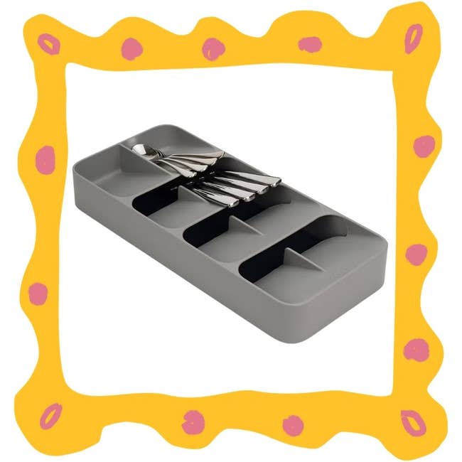 Grey drawer organizer with utensils inside, featuring a unique space-saving design for tidy kitchen storage