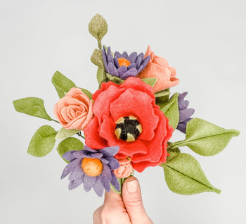 model holding felt flower bouquet