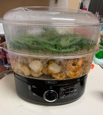 reviewer's two tier steamer with green beans and shrimp in it 