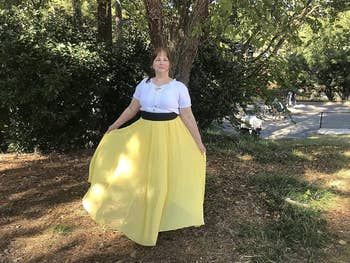 reviewer wearing yellow maxi skirt