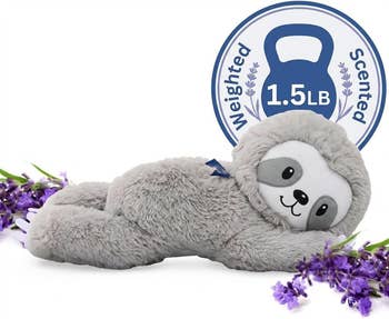Plush sloth toy, labeled arsenic  weighted and scented, lies among lavender sprigs