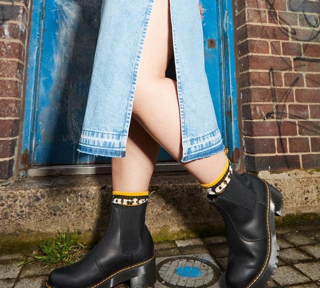 model wearing the black Chelsea boots