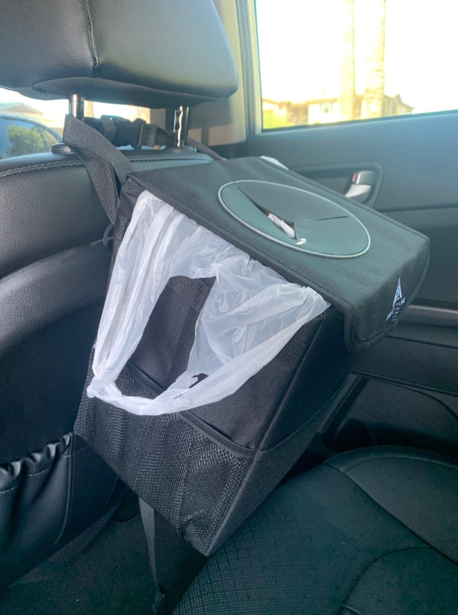 The trash can in the backseat of a car 