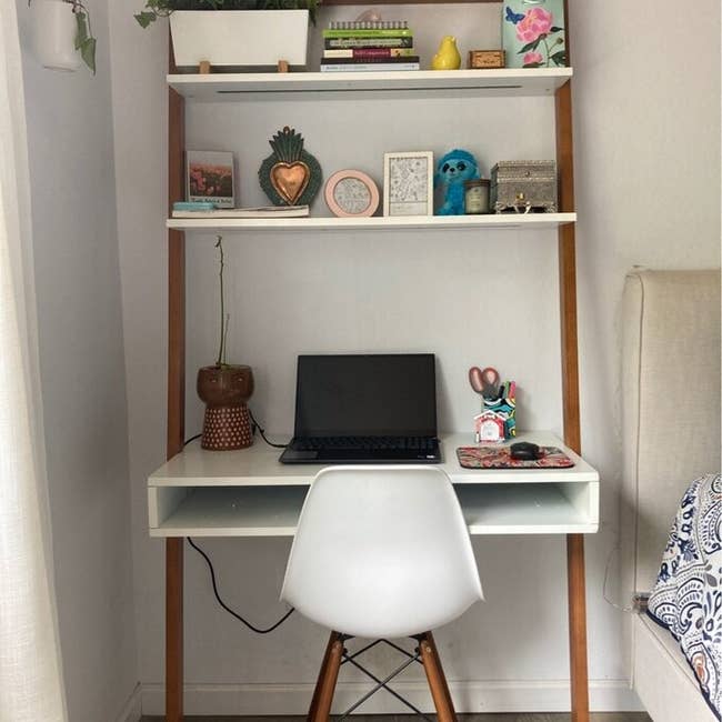 reviewer image of the ladder desk with trinkets on it