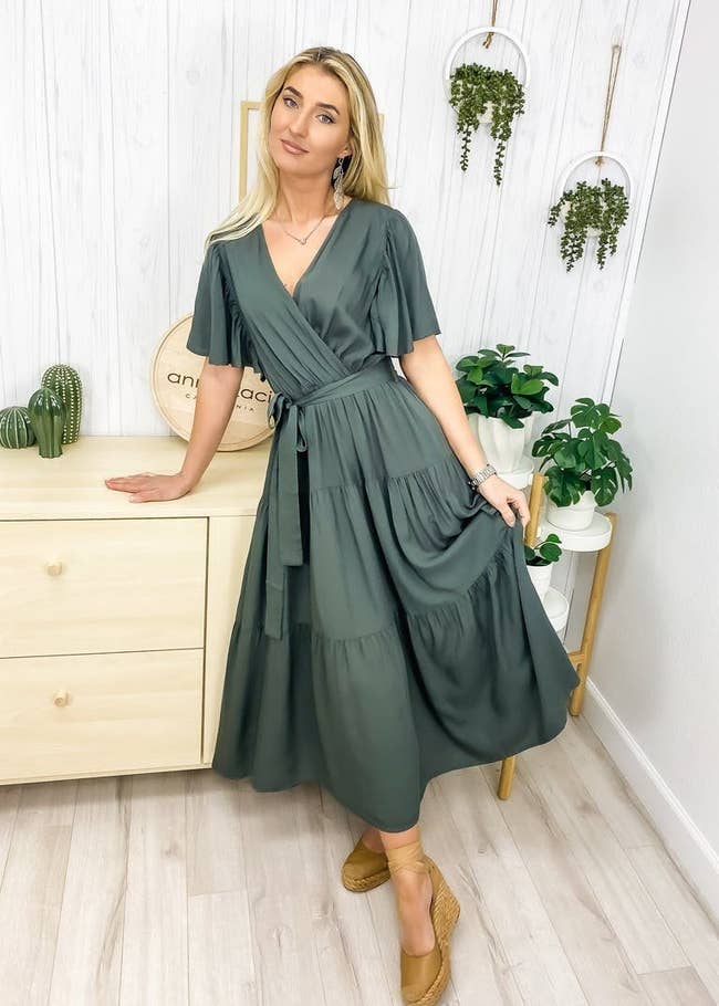 model wearing olive green dress