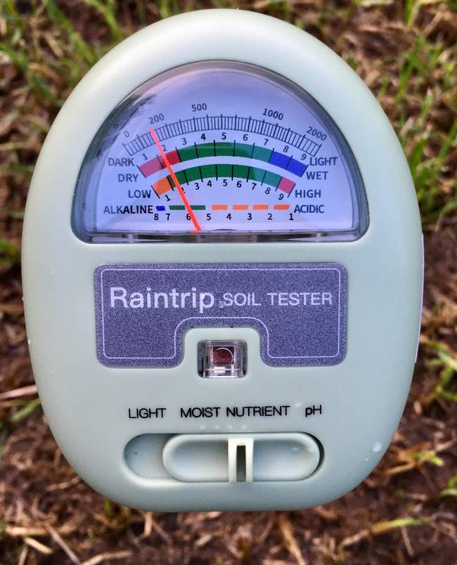 A soil moisture and pH meter with a gauge and various levels indicated for garden care