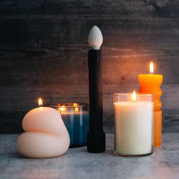 Candle vibrator surrounded by actual candles