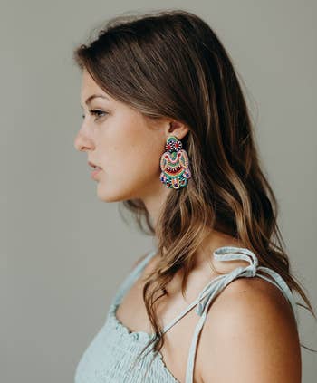 side view of model wearing the beaded earring