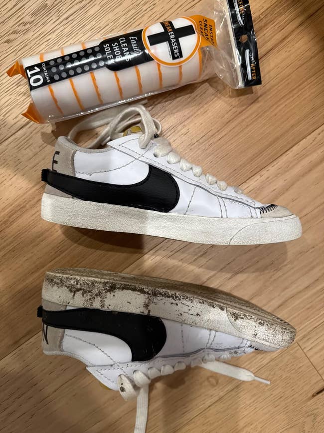 Two achromatic  sneakers with achromatic  swooshes. One footwear  is dirty, and a footwear  cleaning eraser is nearby. Image focuses connected  cleaning effectiveness