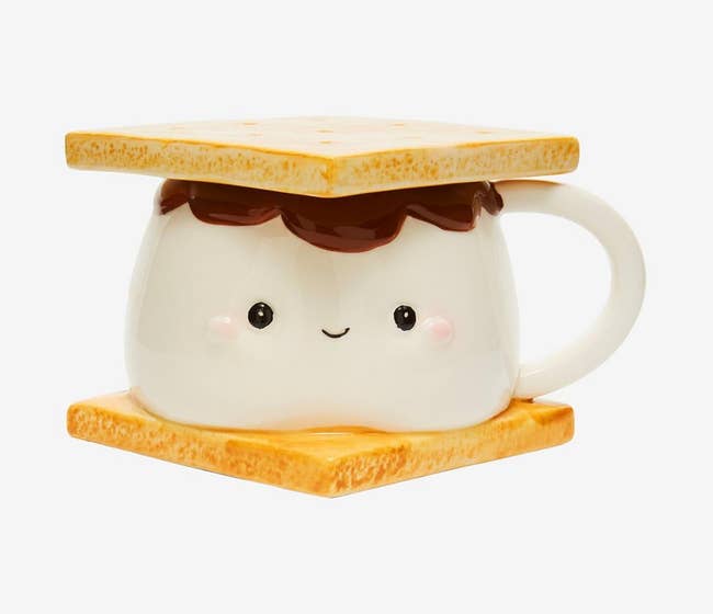 mug that looks like smiling s'more with graham cracker shaped base and lid