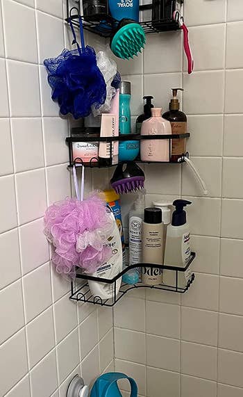 reviewer's bathroom with the three corner shower caddies set up