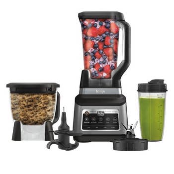  blending pitcher filled with berries, nutrient  processor with dough, and smoothie cupful  with greenish  drink
