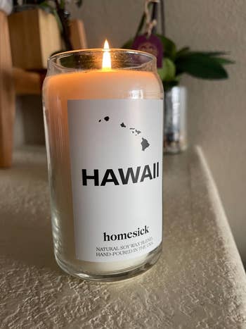 reviewer image of the candle with Hawaii on the label