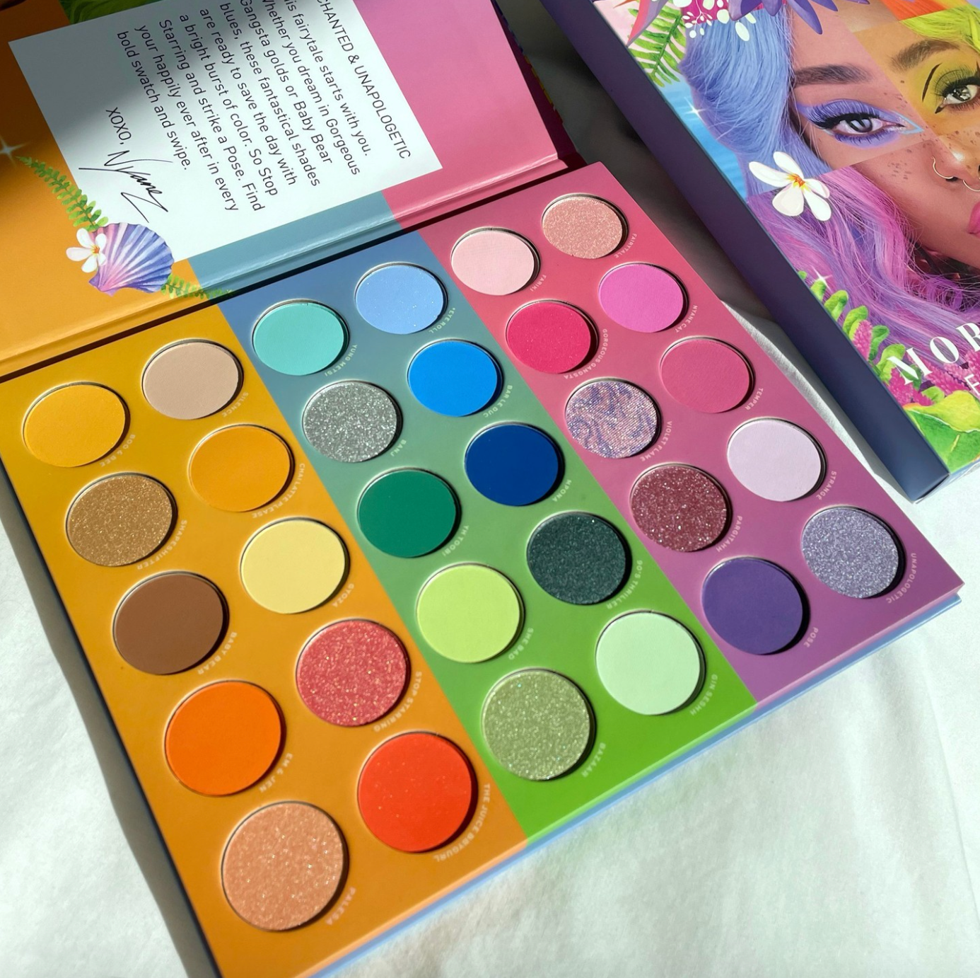 a colorful eyeshadow palette with 30 different colors