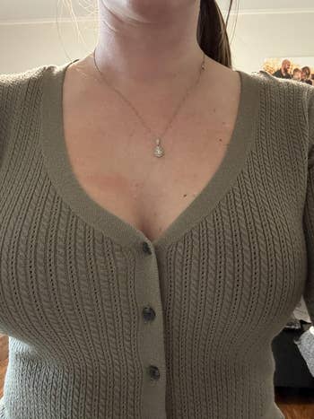 reviewer wearing a ribbed cardigan