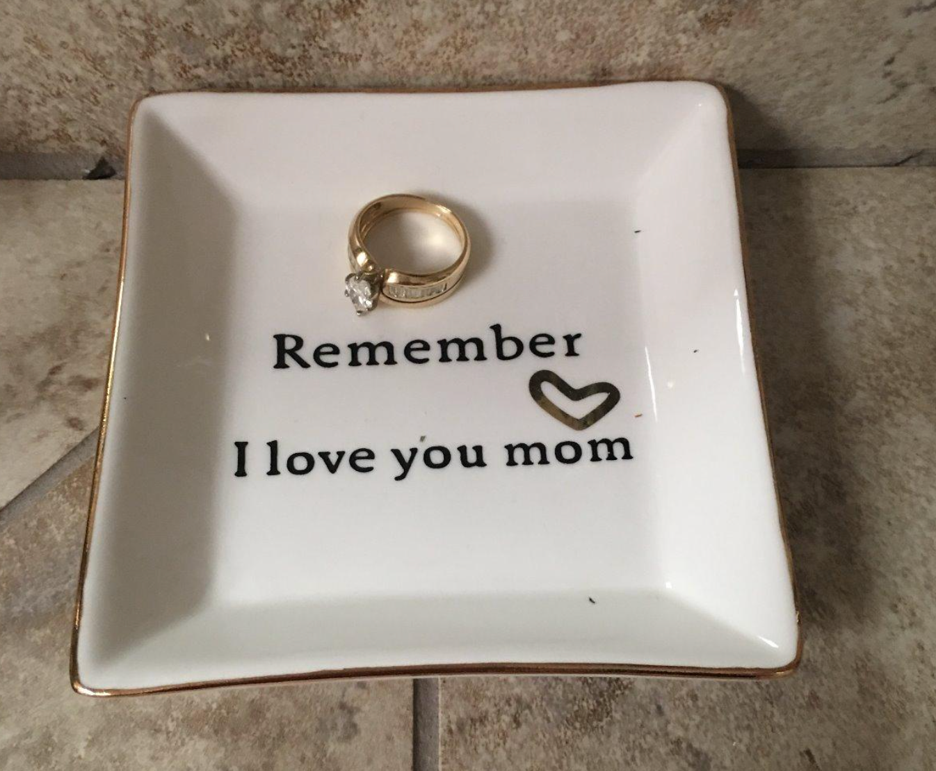 a reviewer photo of their wedding ring in the remember I love you mom trinket dish