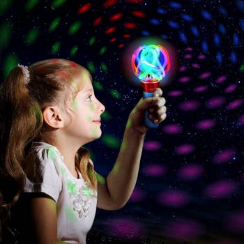 child model holding light up wand