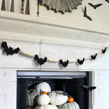 bat and beaded garland over fireplace 