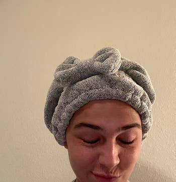 image of reviewer wearing the grey hair towel