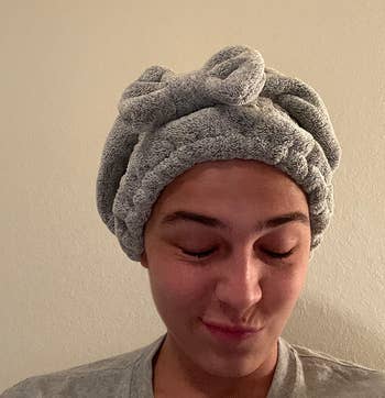 image of reviewer wearing the grey hair towel
