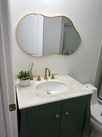 Bathroom with the asymmetrical mirror