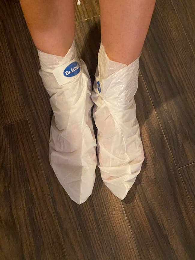 Reviewer wearing foot mask