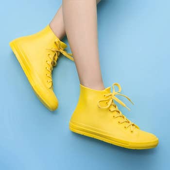 model in yellow high tops