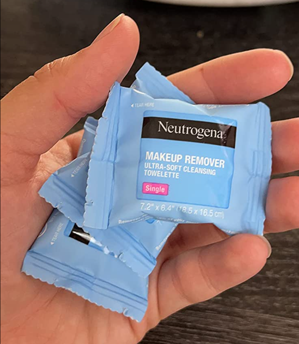 Reviewer holding individually wrapped towelettes 