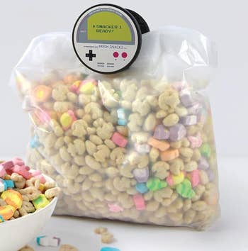 A gameboy themed chip clip on a cereal bag 