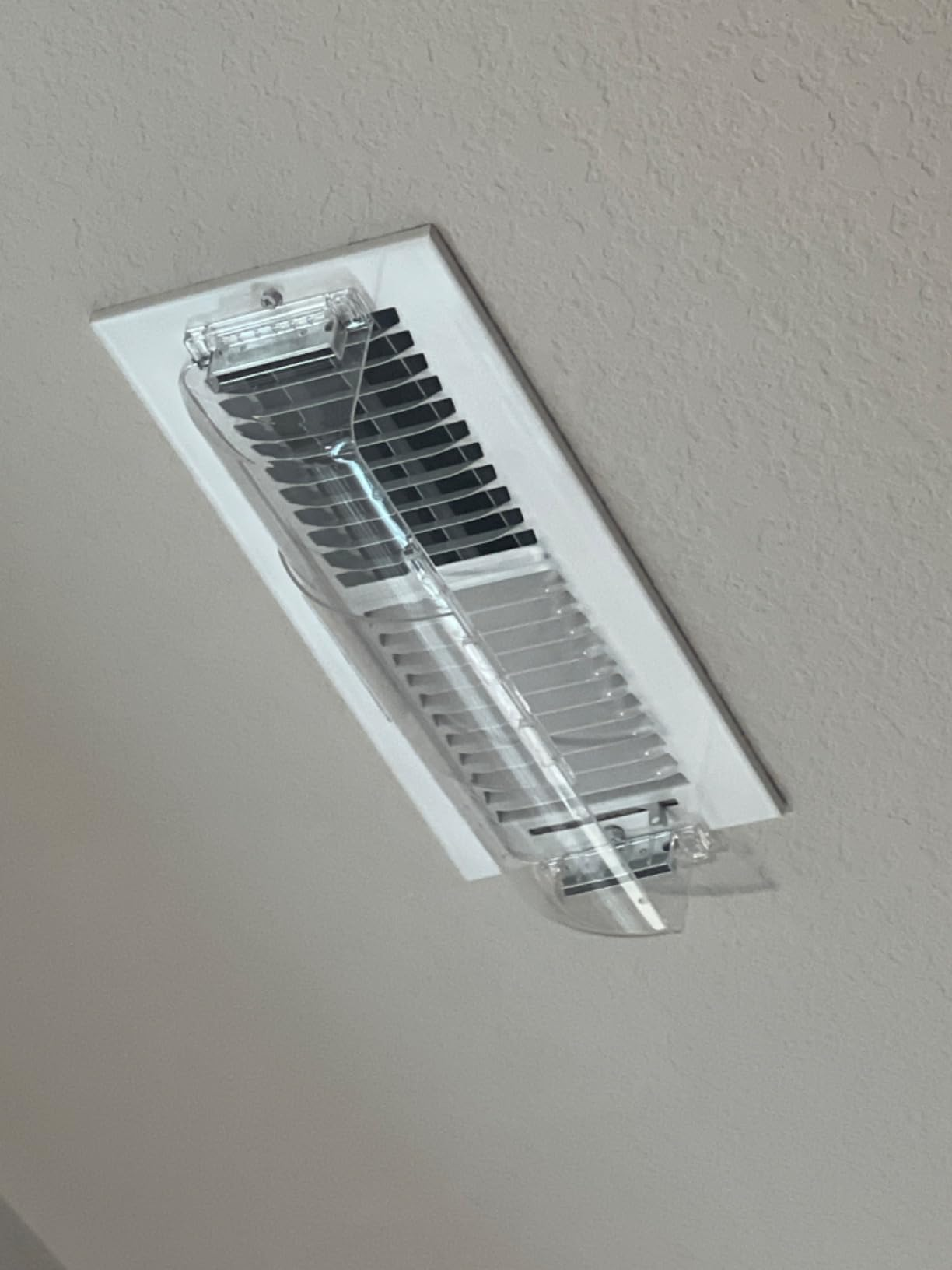 Ceiling-mounted rectangular aerial  vent with a wide   integrative  cover, suggesting features for location  betterment  oregon  aerial  circulation products
