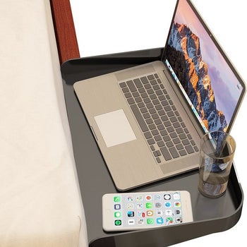 Bedside laptop table with laptop on top