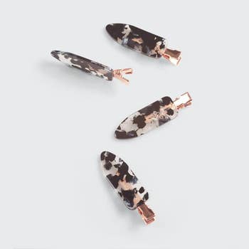 Four hair clips with tortoiseshell pattern and rose gold accents