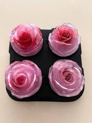 four pink rose-shaped ice cubes