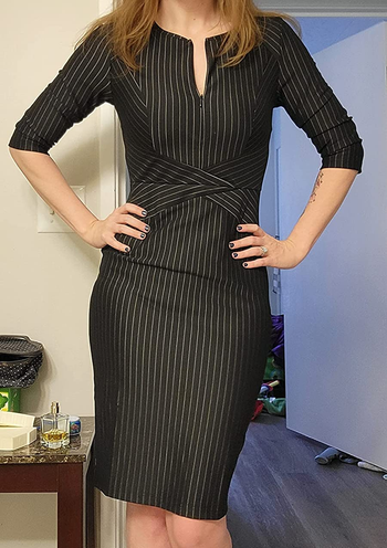 Image of reviewer wearing black striped pencil dress