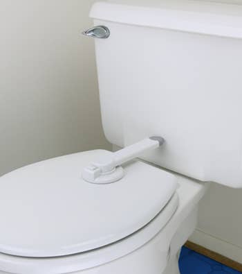 toilet lock secured on top of a toilet seat