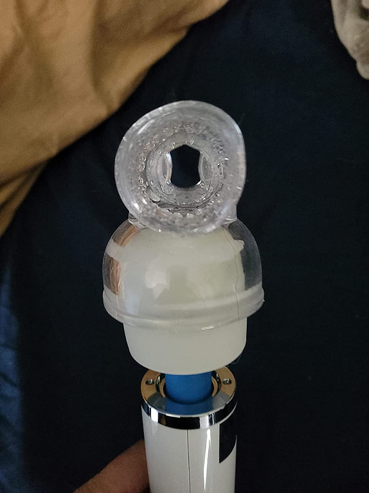 Wand with transparent sleeve attachment showing opening