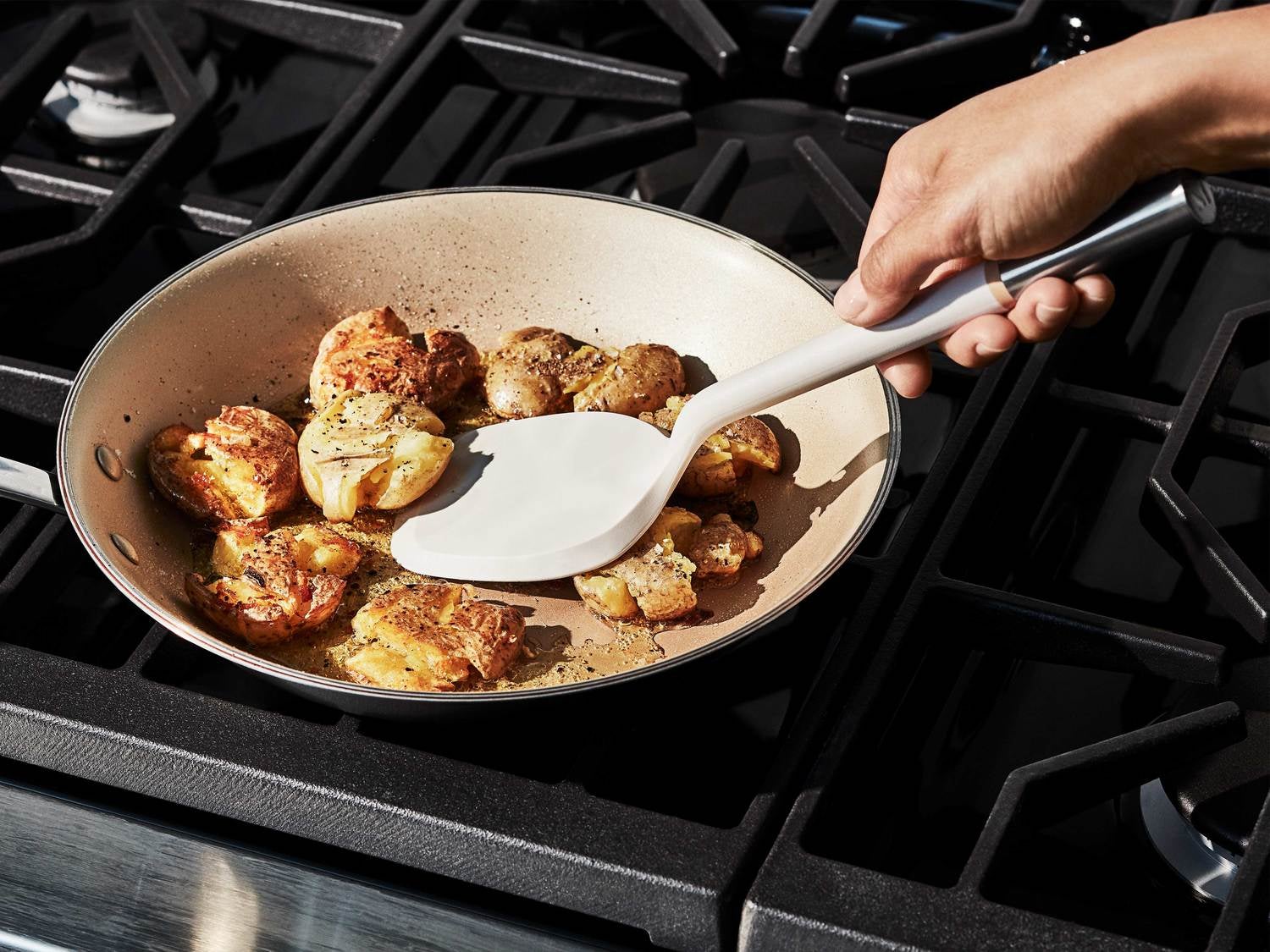 the spatula being used in pan on stove