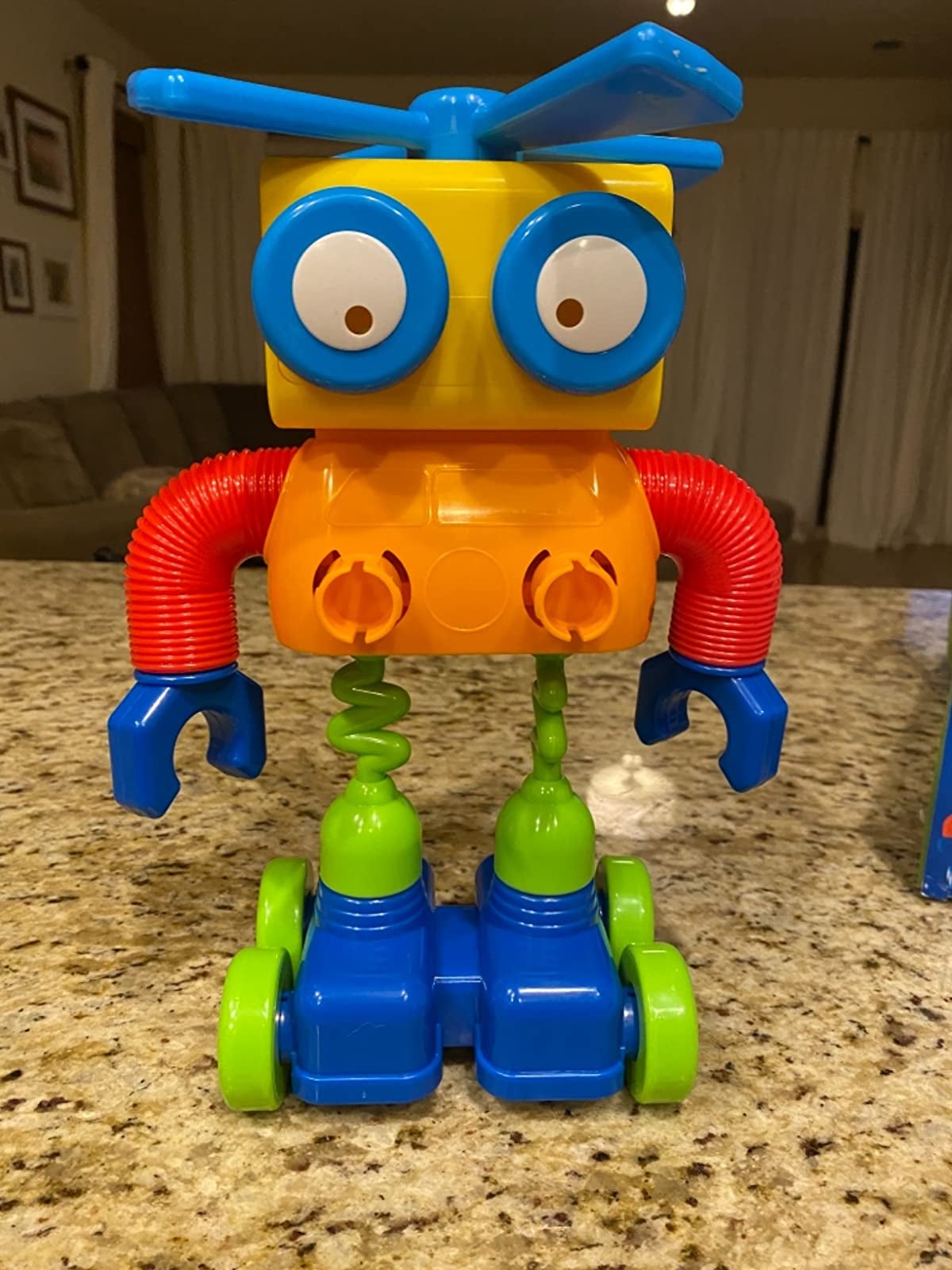 Reviewer's image of primary colored robot toy