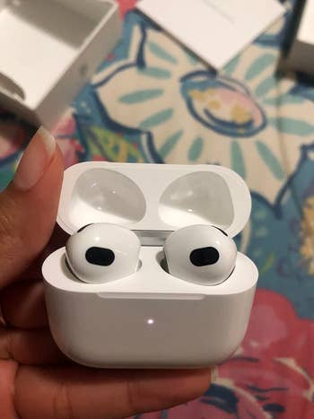 the airpods in their case