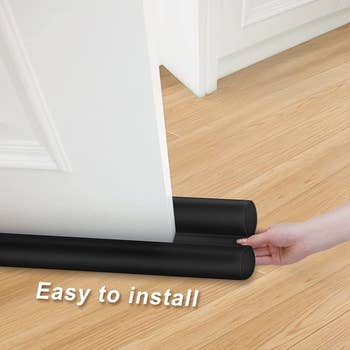 graphic showing how the draft stopper slides under the door for easy installation